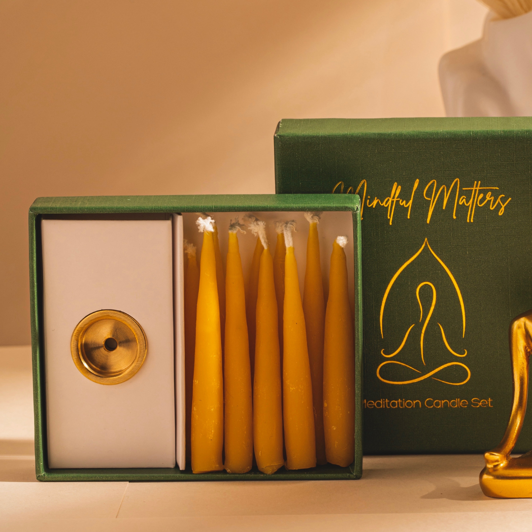 The Meditation Candle Set open, showing the brass candle holder and a row of yellow beeswax candles